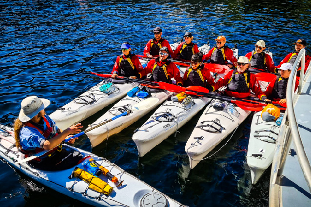 Group of kayakers in Doubtful Sound rafted together